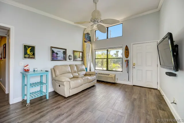 a living room with furniture and a flat screen tv