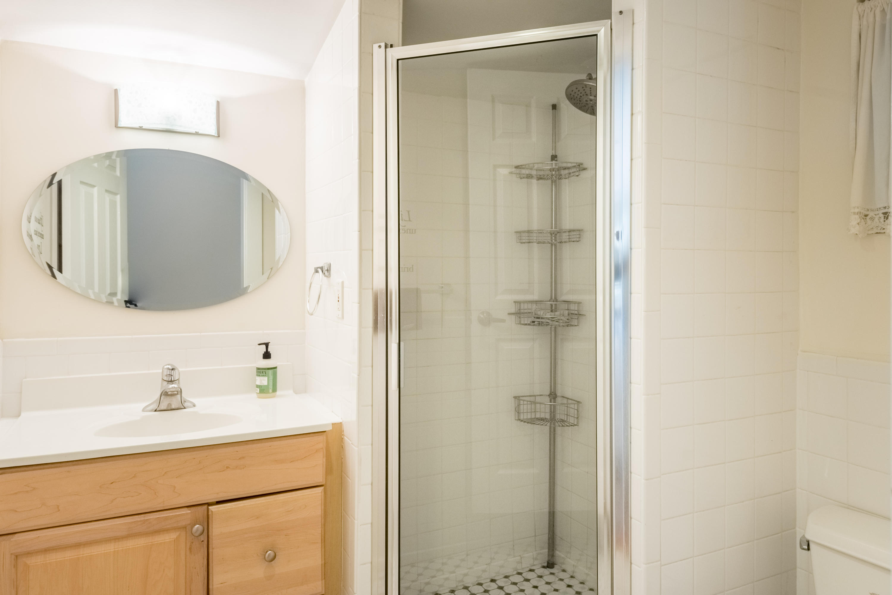 702 Florida Street Key West, FL 33040 - Photo 11 of 16 a bathroom with a shower sink and mirror