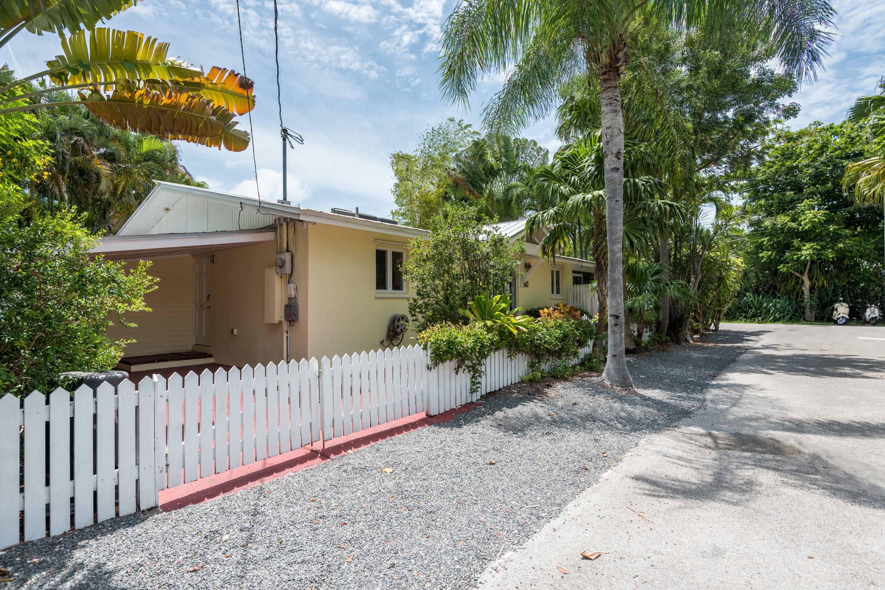 702 Florida Street Key West, FL 33040 - Photo 16 of 16 a front view of a house with a garden