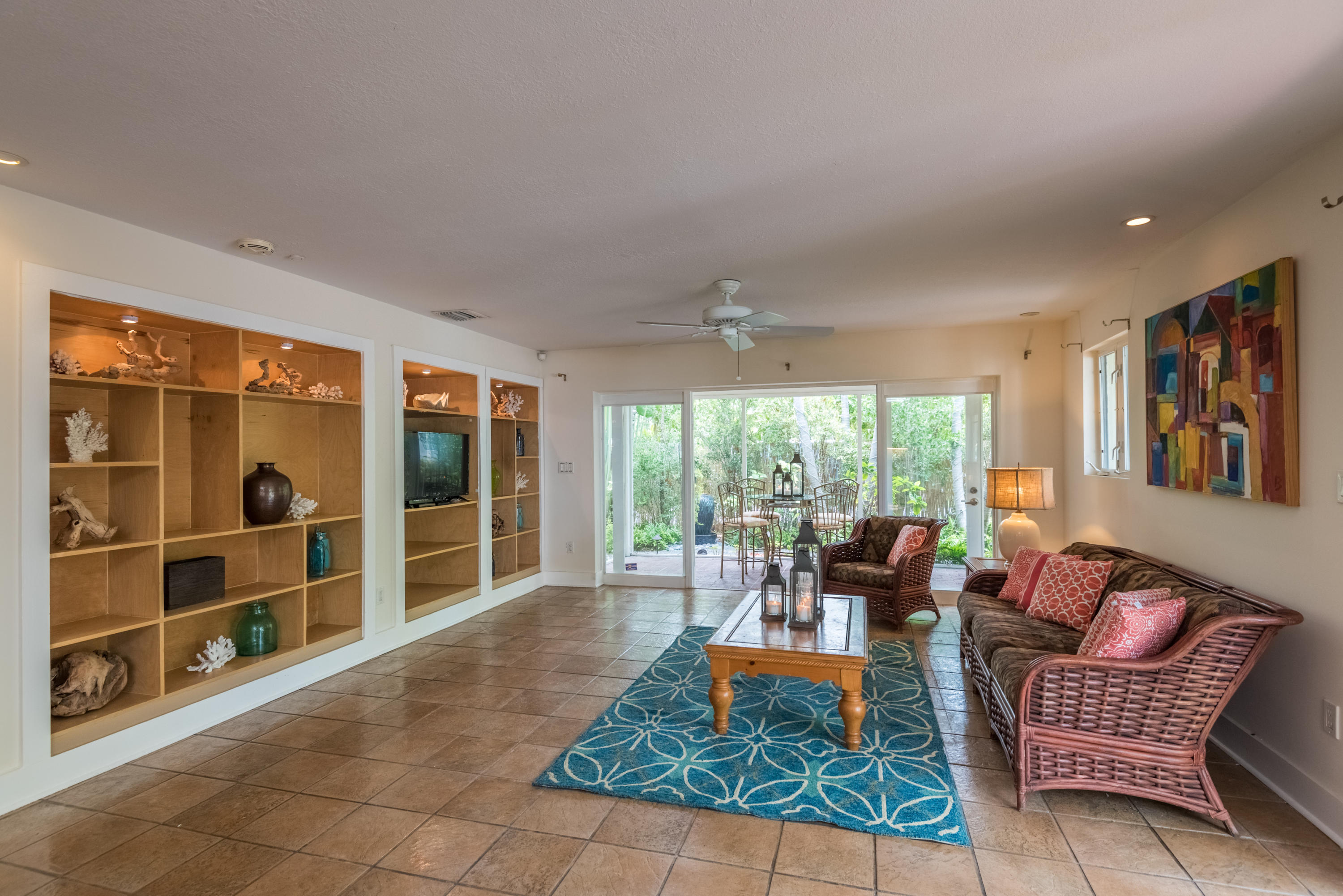 702 Florida Street Key West, FL 33040 - Photo 2 of 16 a living room with furniture and a floor to ceiling window