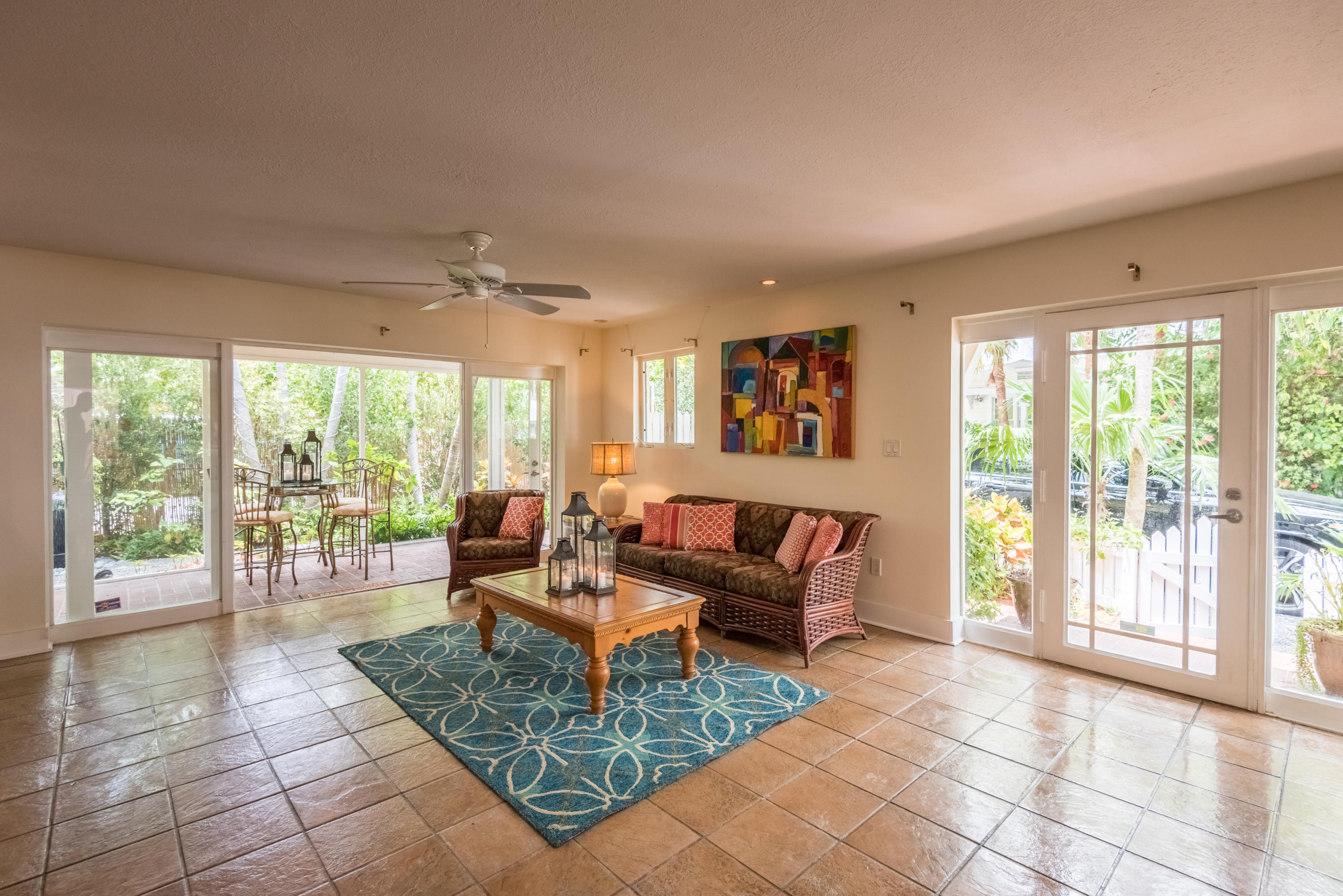 702 Florida Street Key West, FL 33040 - Photo 3 of 16 a living room with furniture and large windows