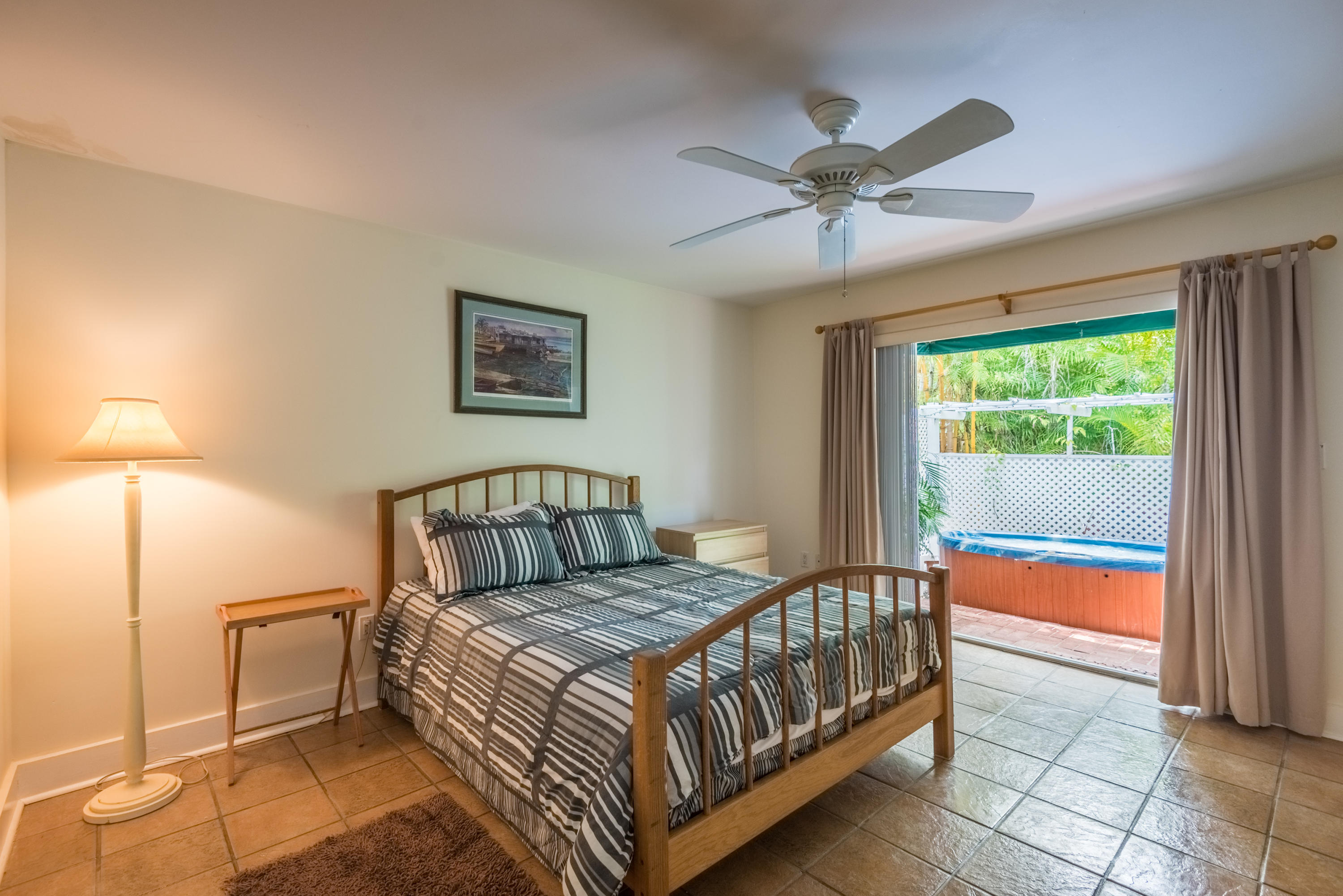 702 Florida Street Key West, FL 33040 - Photo 6 of 16 a spacious bedroom with a bed and window