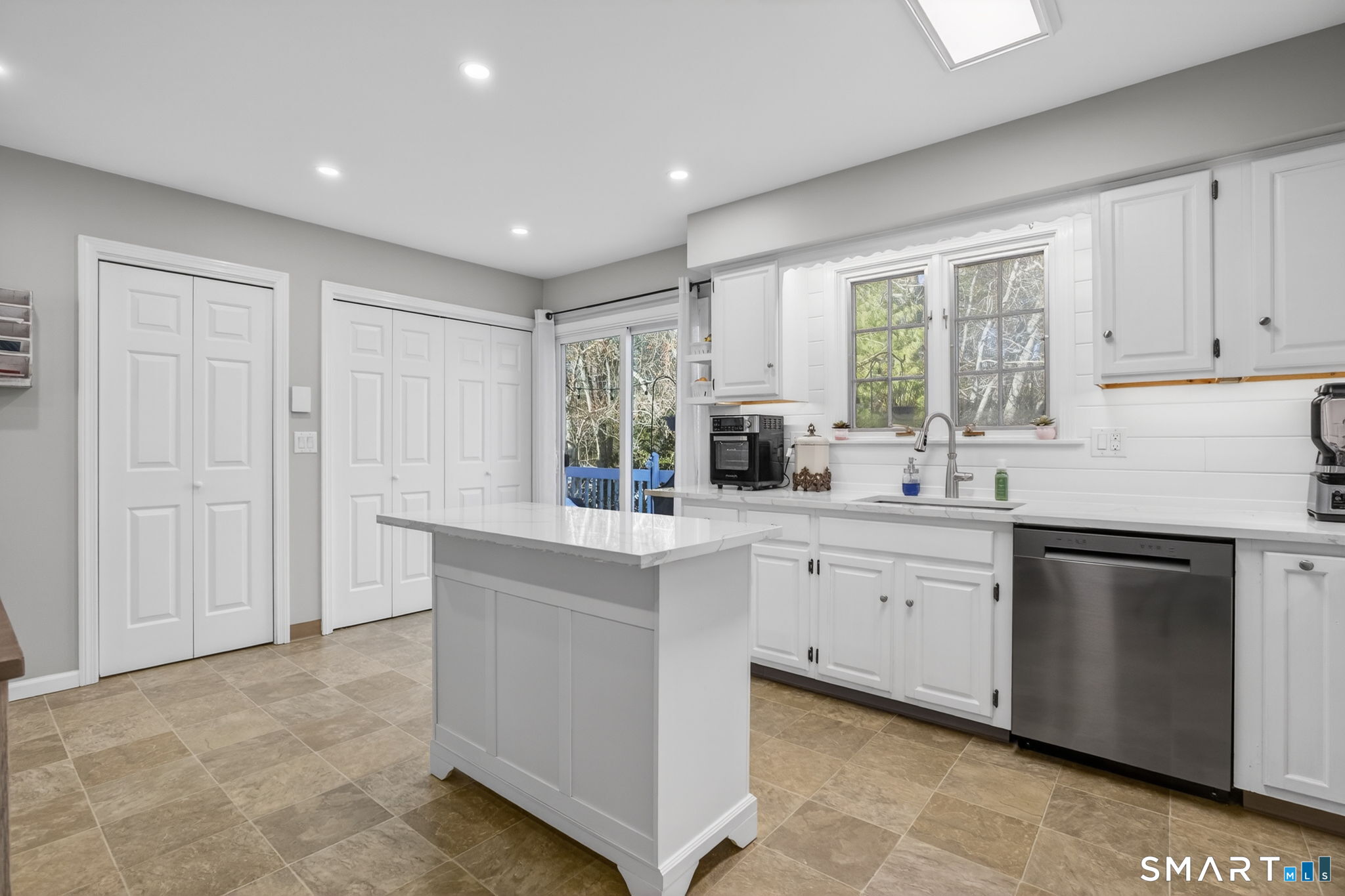 81 Founders Village, Unit 81 Clinton, CT 06413 - Photo 14 of 29 a kitchen with granite countertop white cabinets and white appliances