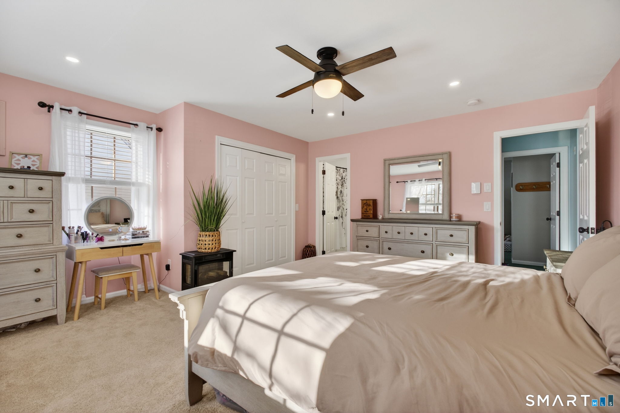 81 Founders Village, Unit 81 Clinton, CT 06413 - Photo 21 of 29 a bedroom with a bed a desk and chair