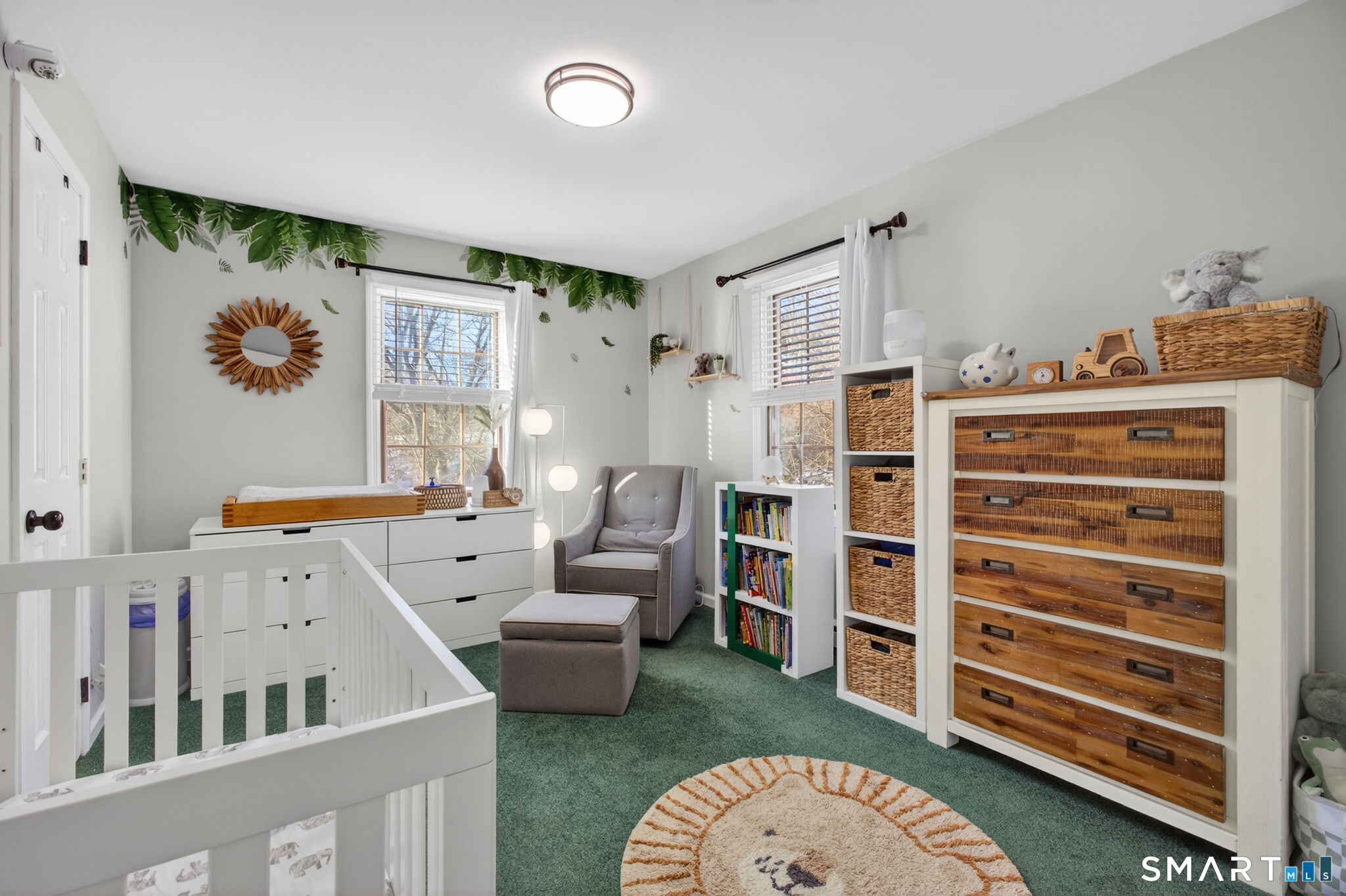 81 Founders Village, Unit 81 Clinton, CT 06413 - Photo 25 of 29 a view of a bedroom with baby crib and lounge chair