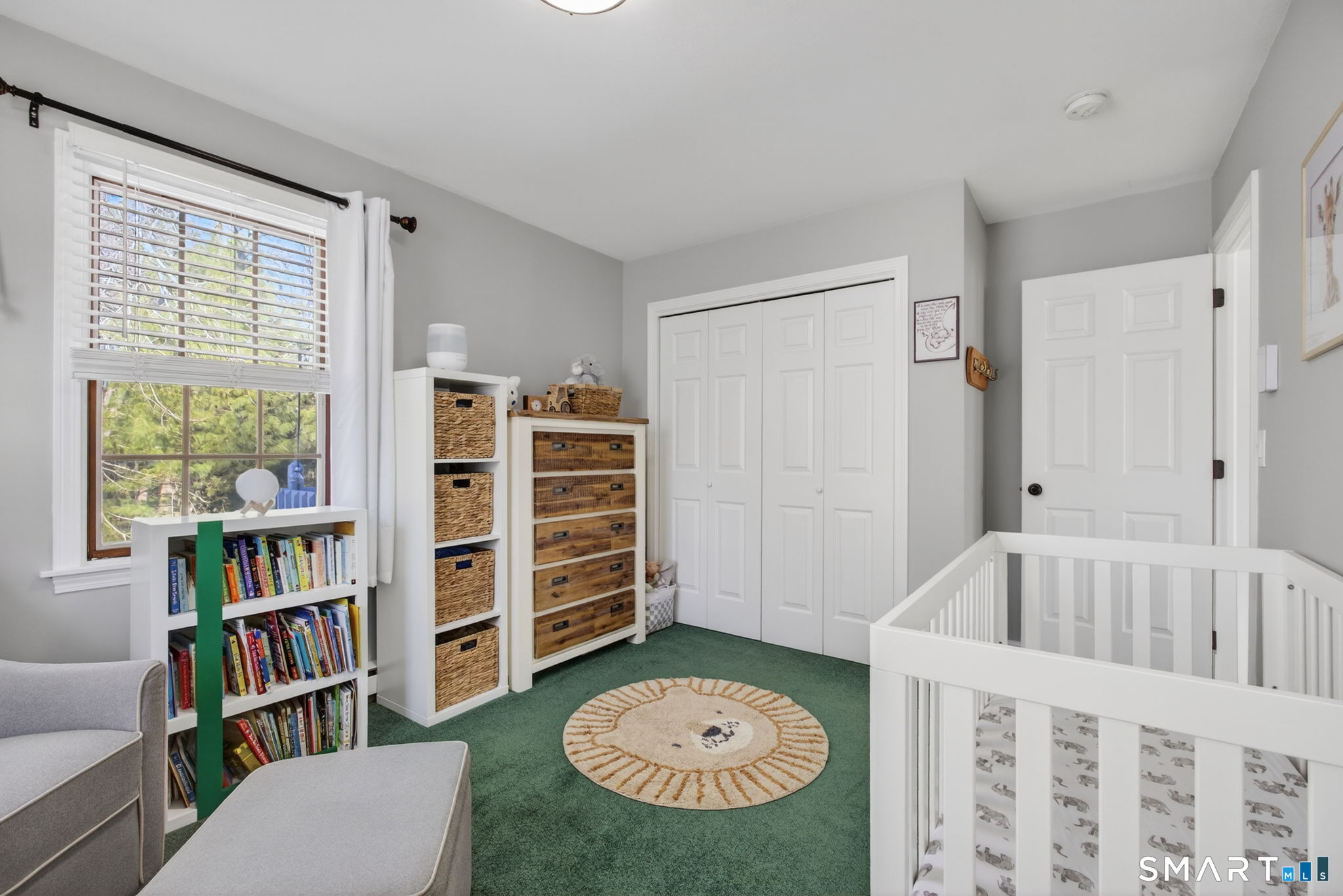 81 Founders Village, Unit 81 Clinton, CT 06413 - Photo 26 of 29 a view of a bedroom with baby crib and a window