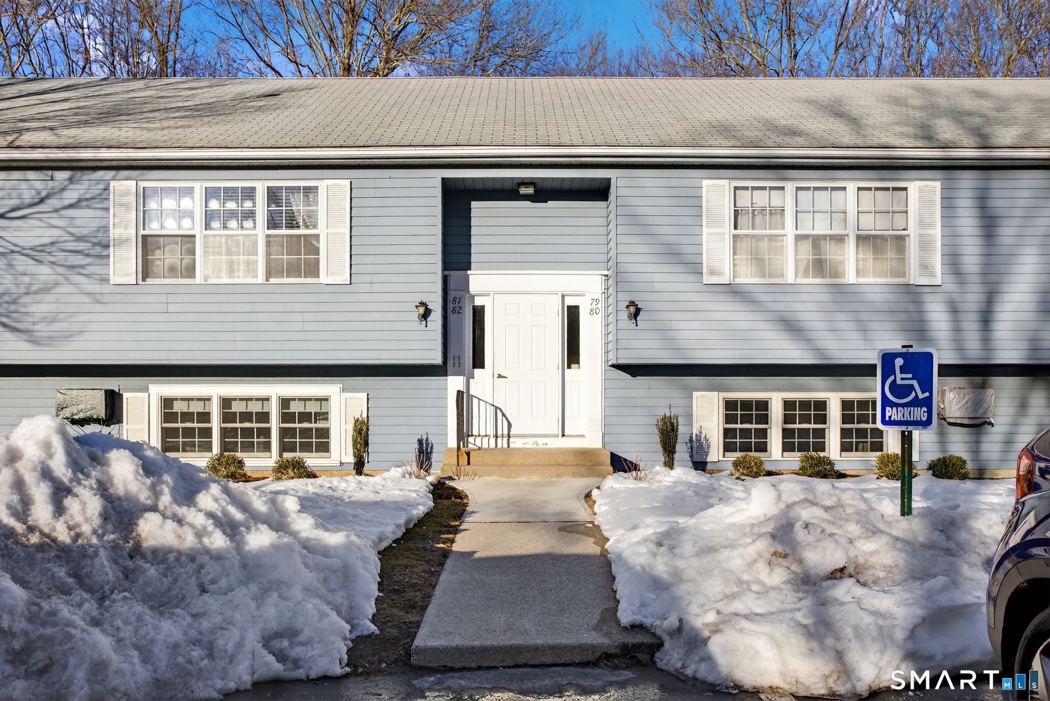 81 Founders Village, Unit 81 Clinton, CT 06413 - Photo 3 of 29 a front view of a house with large windows