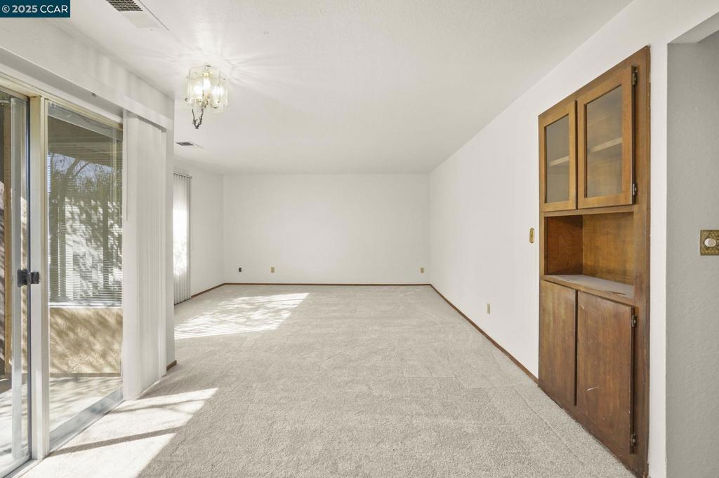 1440 Reganti Place Concord, CA 94518 - Photo 3 of 15 a view of a big room with windows and chandelier