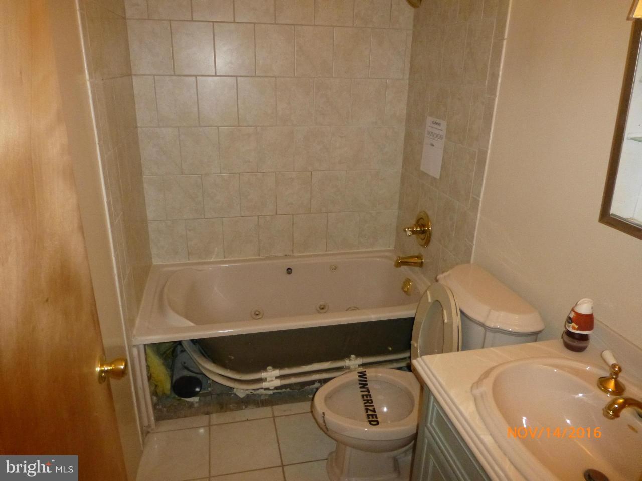 8598 Manorfield Road Baltimore, MD 21236 - Photo 14 of 16 a bathroom with a sink and a toilet