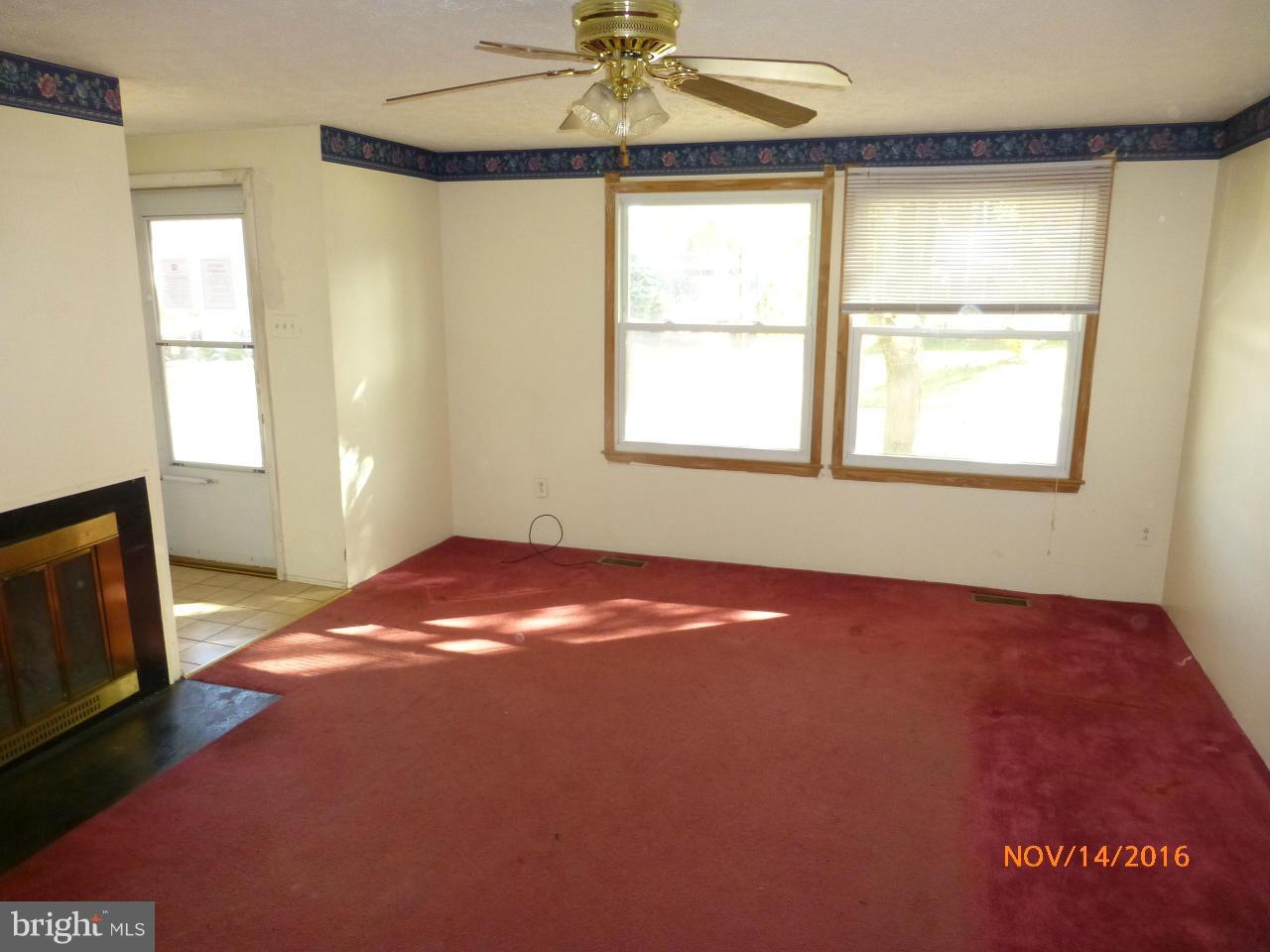 8598 Manorfield Road Baltimore, MD 21236 - Photo 4 of 16 a view of an empty room with a window