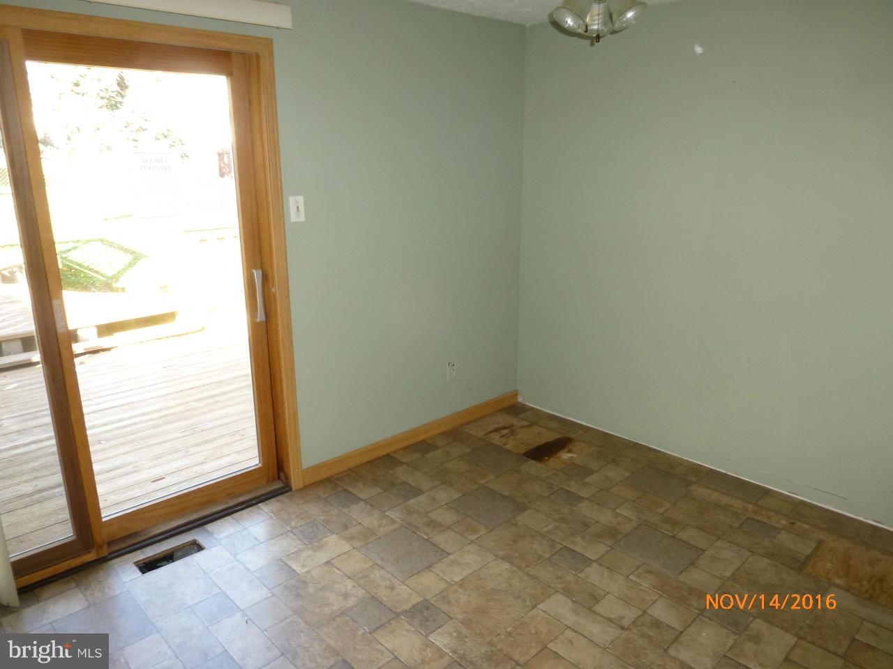8598 Manorfield Road Baltimore, MD 21236 - Photo 8 of 16 an empty room with a window