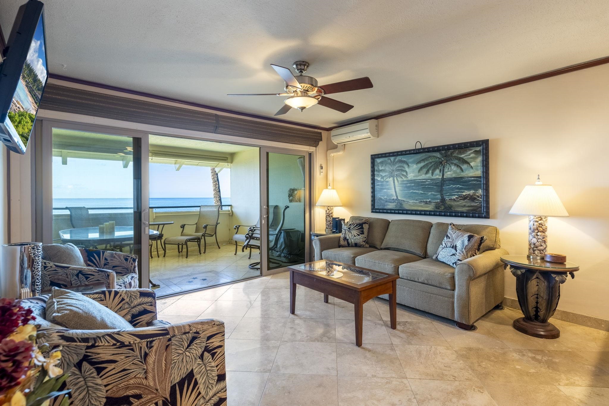 2075 South Kihei Road, Unit 214 Kihei, HI 96753 - Photo 19 of 50 a living room with furniture and a floor to ceiling window