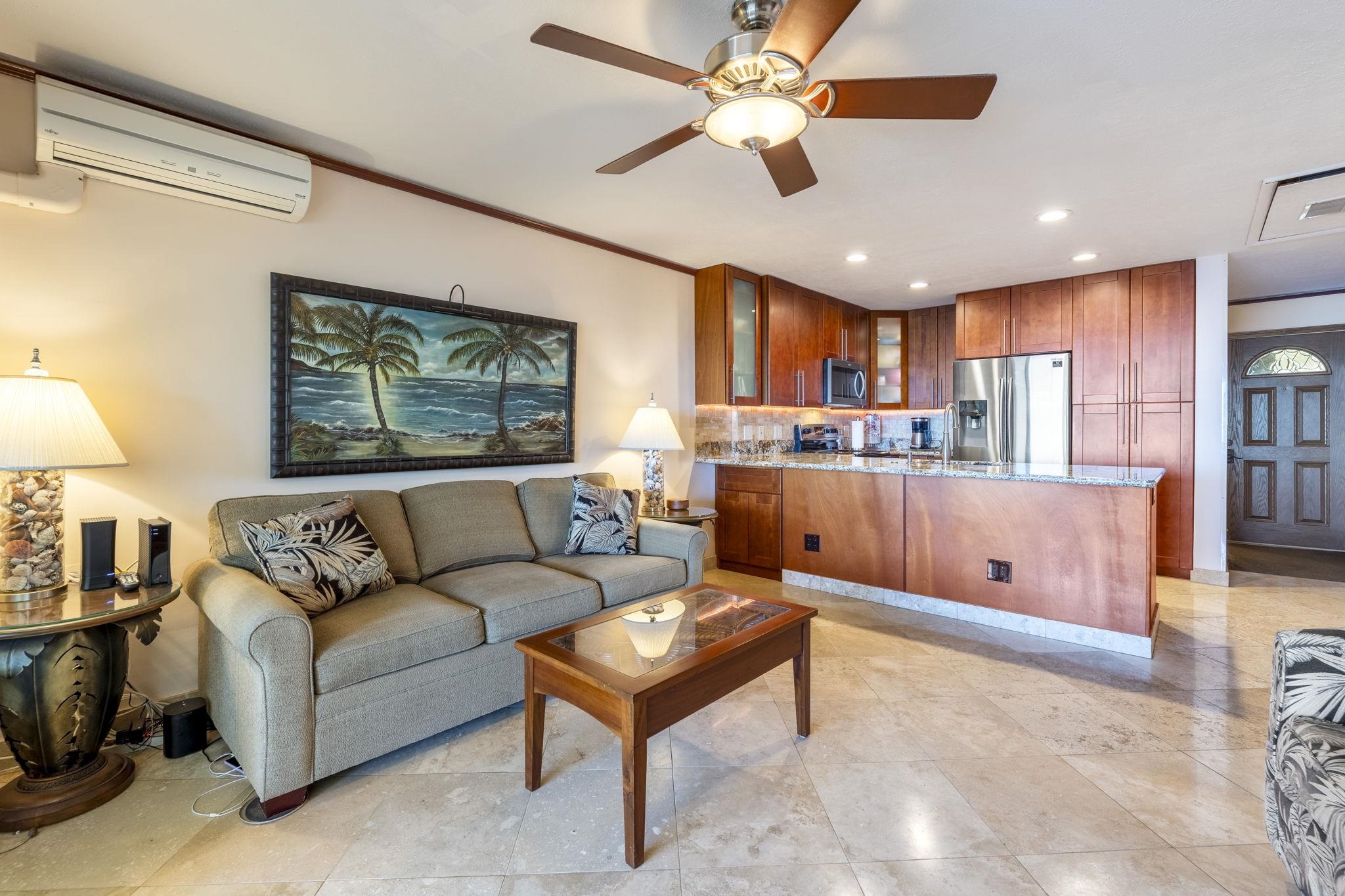 2075 South Kihei Road, Unit 214 Kihei, HI 96753 - Photo 2 of 50 a living room with stainless steel appliances kitchen island furniture and a open kitchen view