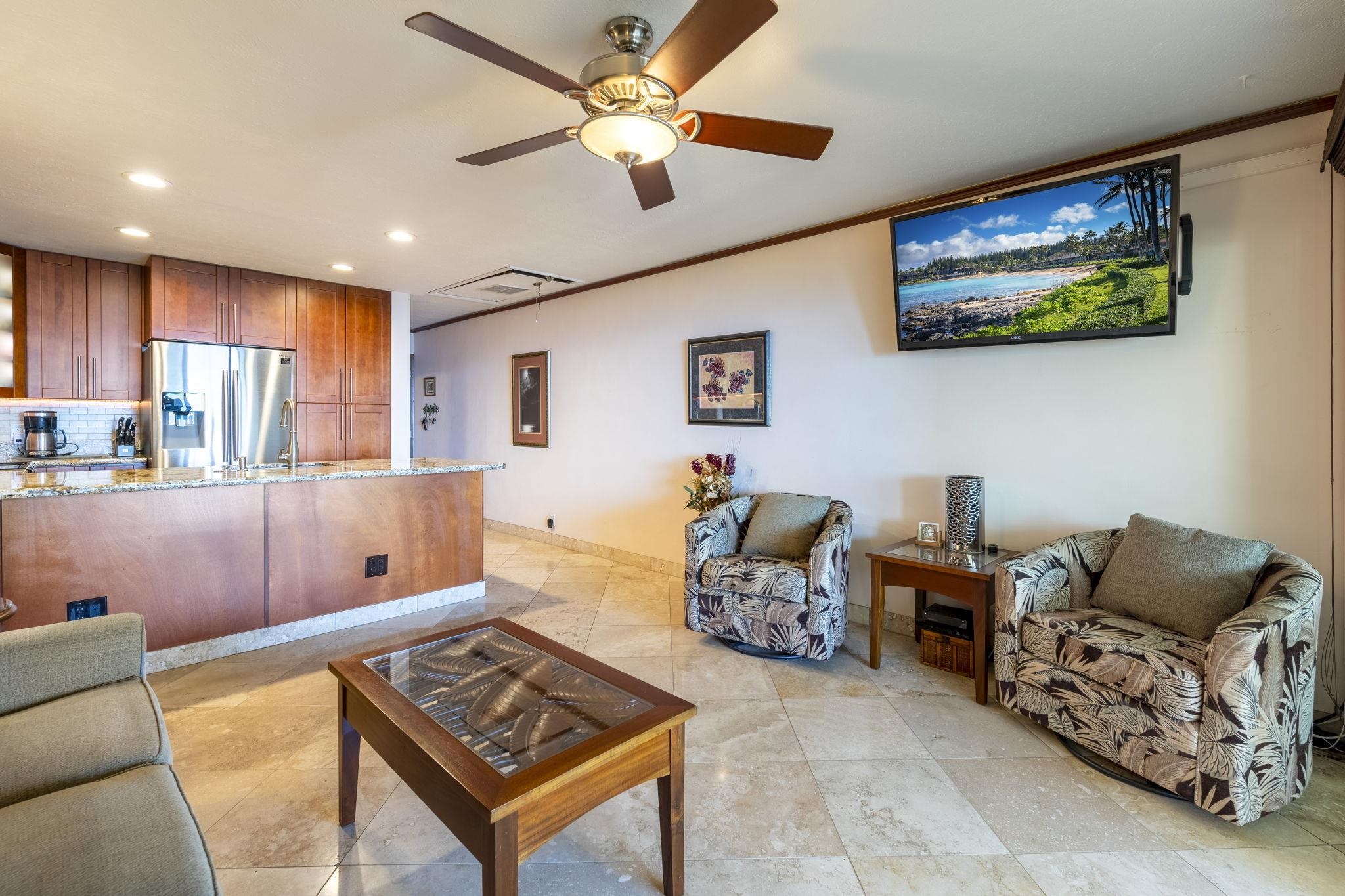 2075 South Kihei Road, Unit 214 Kihei, HI 96753 - Photo 21 of 50 a living room with furniture and a flat screen tv