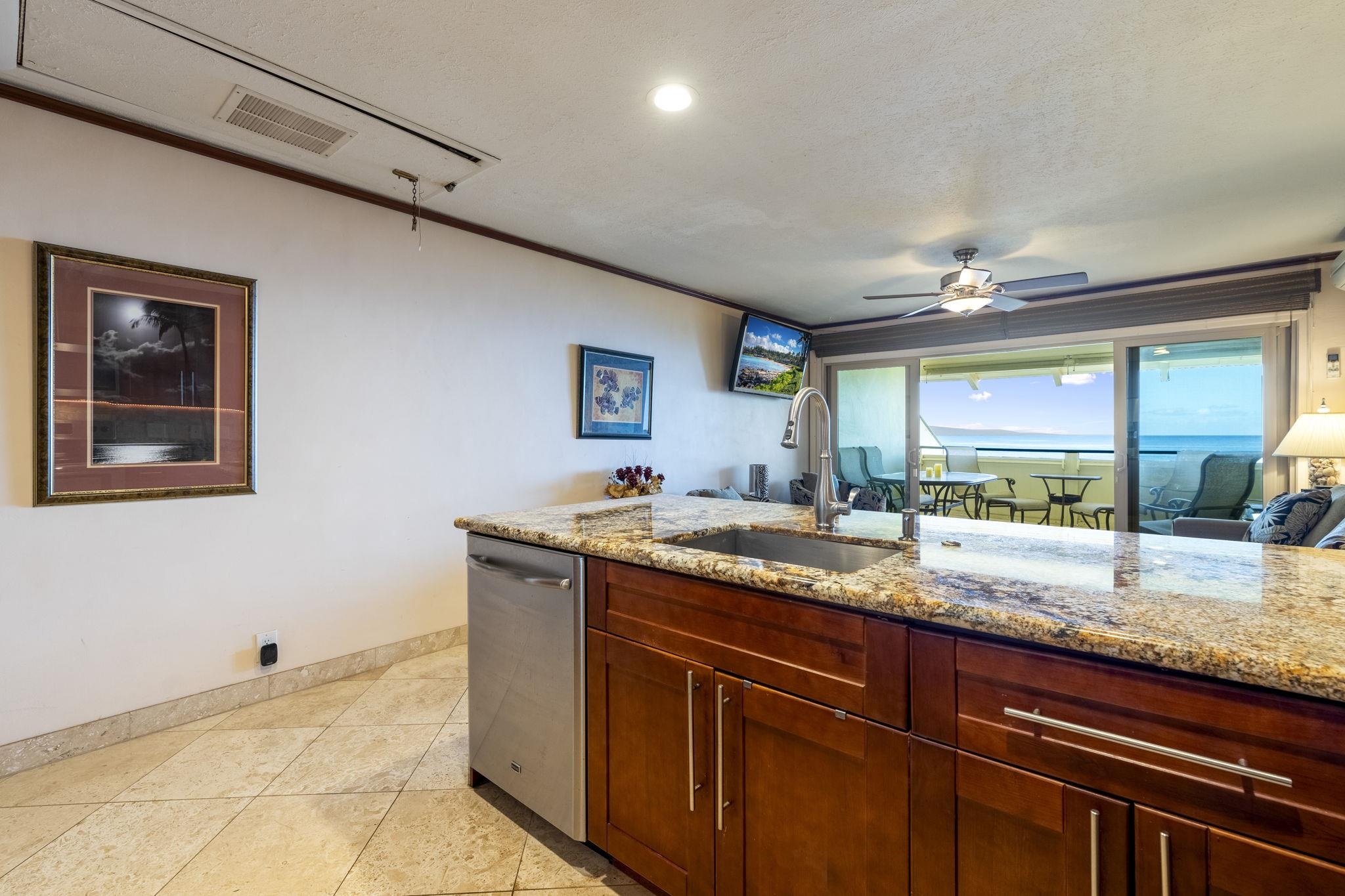 2075 South Kihei Road, Unit 214 Kihei, HI 96753 - Photo 24 of 50 a living room with granite countertop kitchen island furniture and a large window