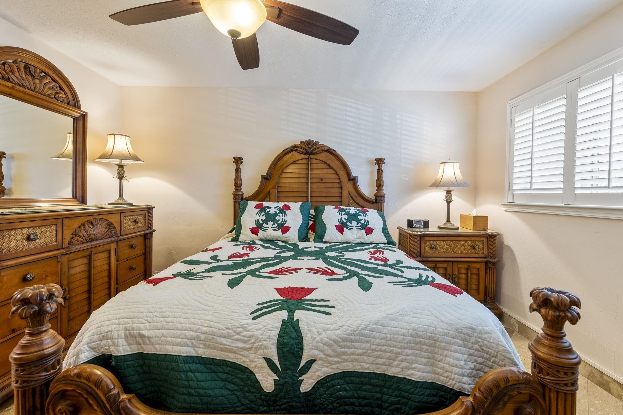 2075 South Kihei Road, Unit 214 Kihei, HI 96753 - Photo 33 of 50 a bedroom with a bed a dresser next to a window