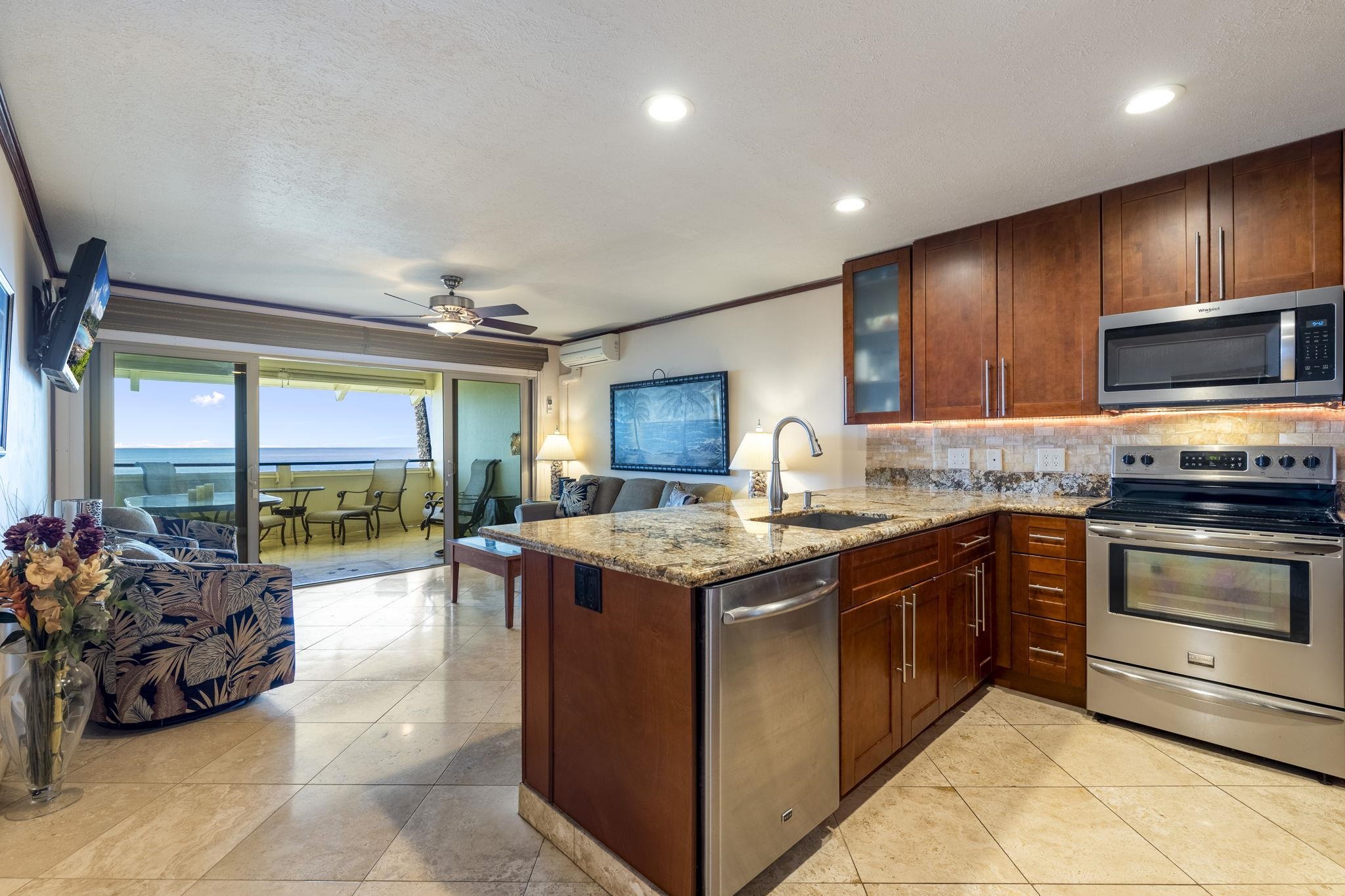 2075 South Kihei Road, Unit 214 Kihei, HI 96753 - Photo 6 of 50 a kitchen with stainless steel appliances granite countertop a stove and a sink