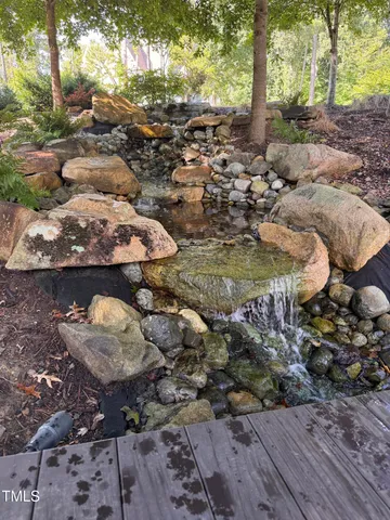 a view of a chairs and table in a patio