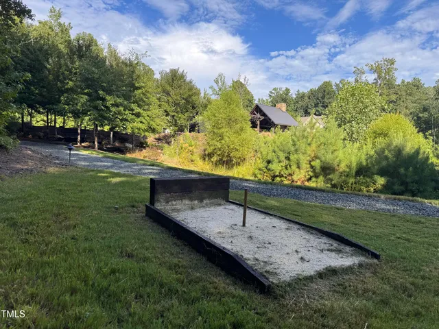 a water fountain is sitting in the middle of a lake