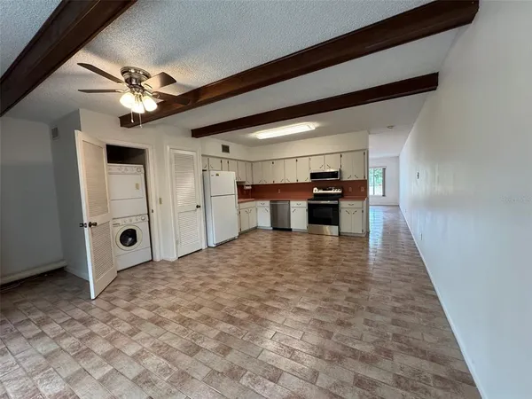 a view of a kitchen with a sink