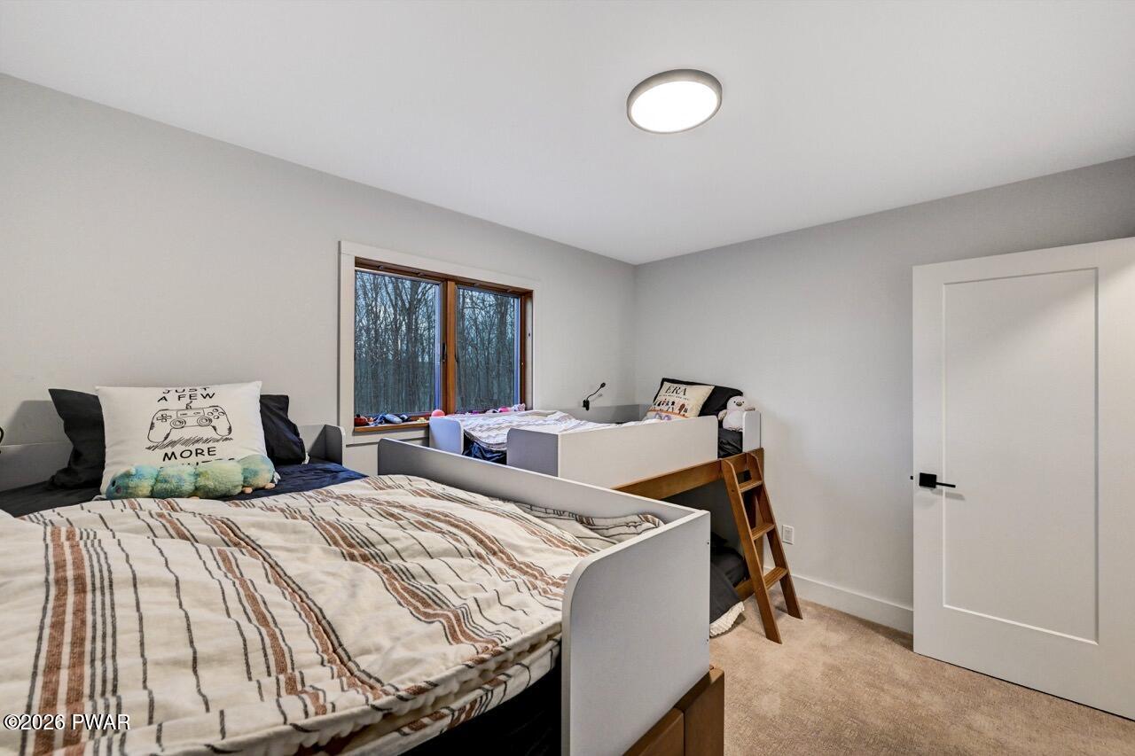 258 Lakeview Road Lackawaxen, PA 18435 - Photo 60 of 119 a bedroom with a bed and a window