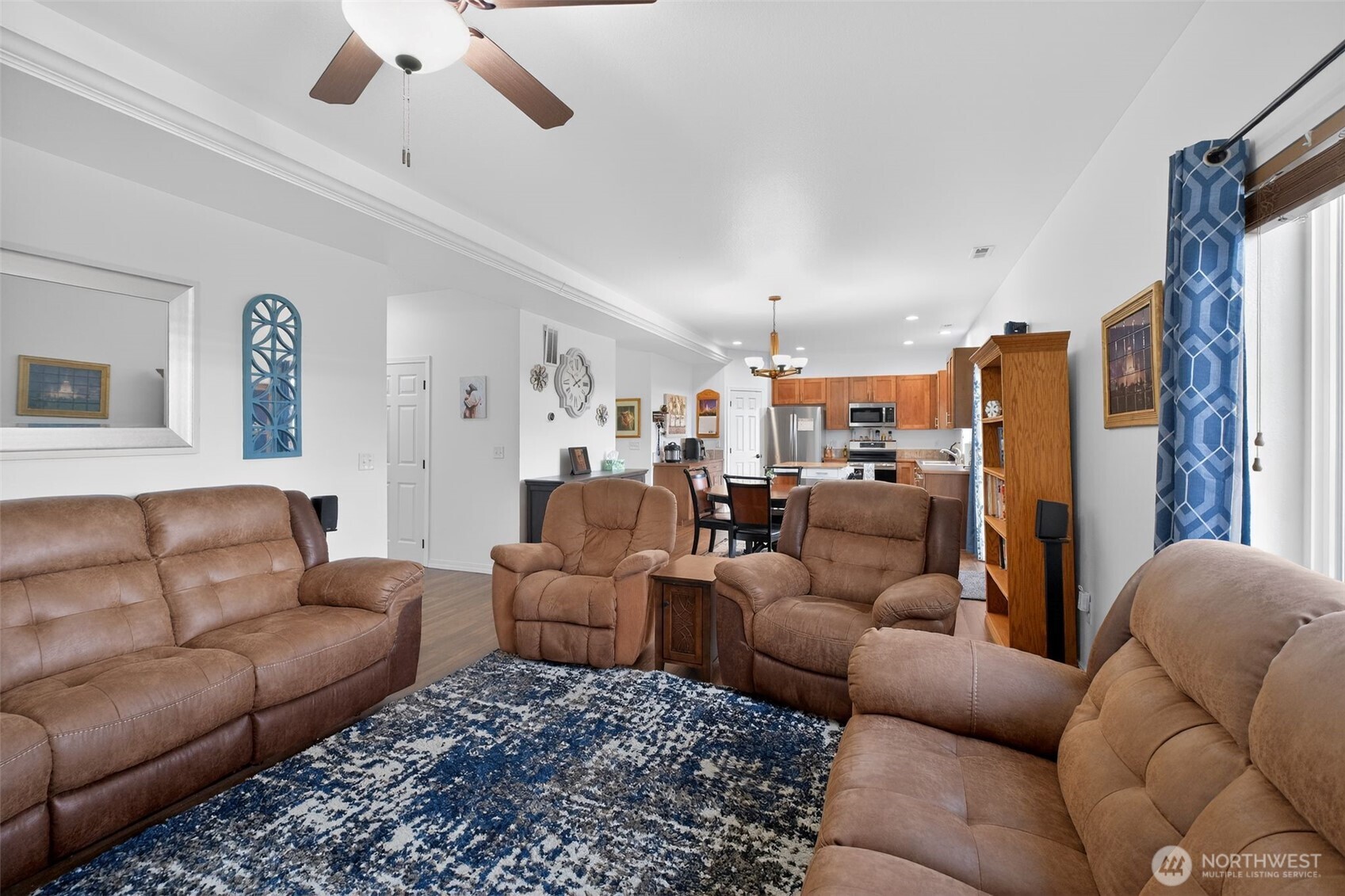 1427 West Century Street Moses Lake, WA 98837 - Photo 14 of 30 a living room with furniture kitchen view and a chandelier