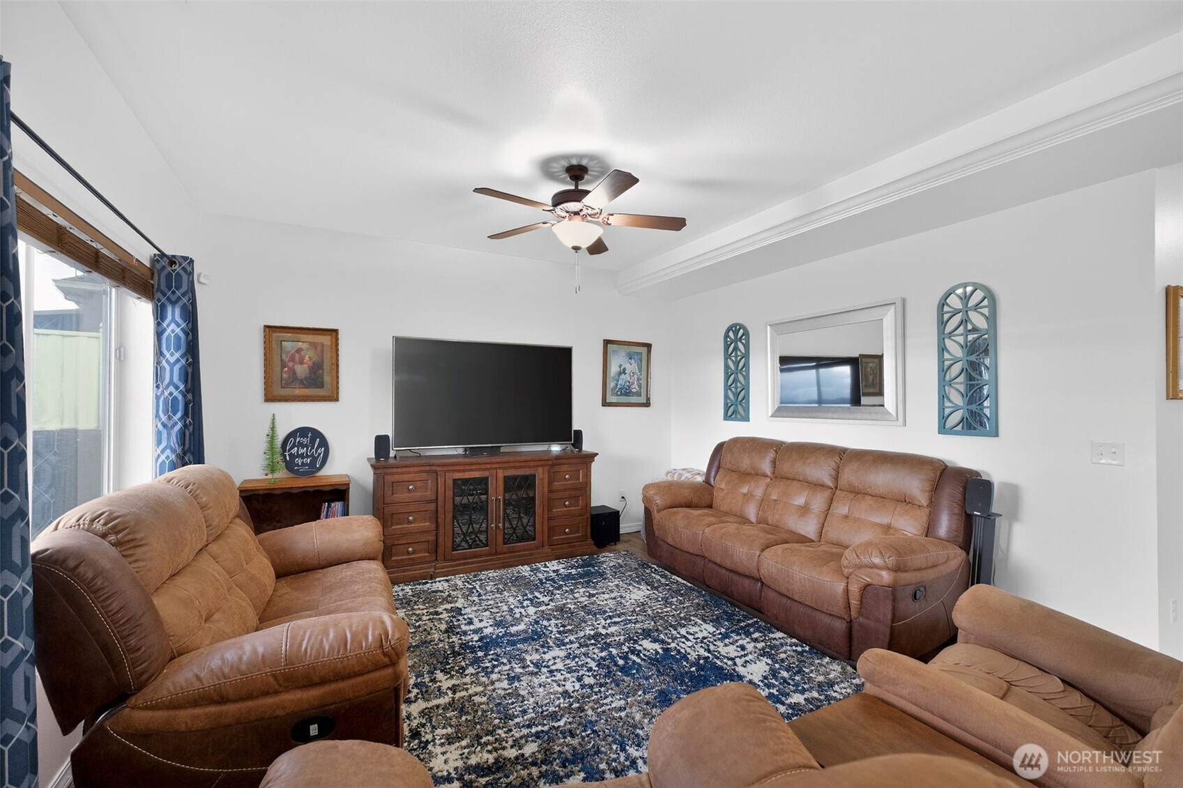 1427 West Century Street Moses Lake, WA 98837 - Photo 2 of 30 a living room with furniture workspace and a flat screen tv