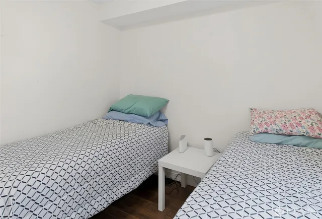 a bedroom with a bed and chair