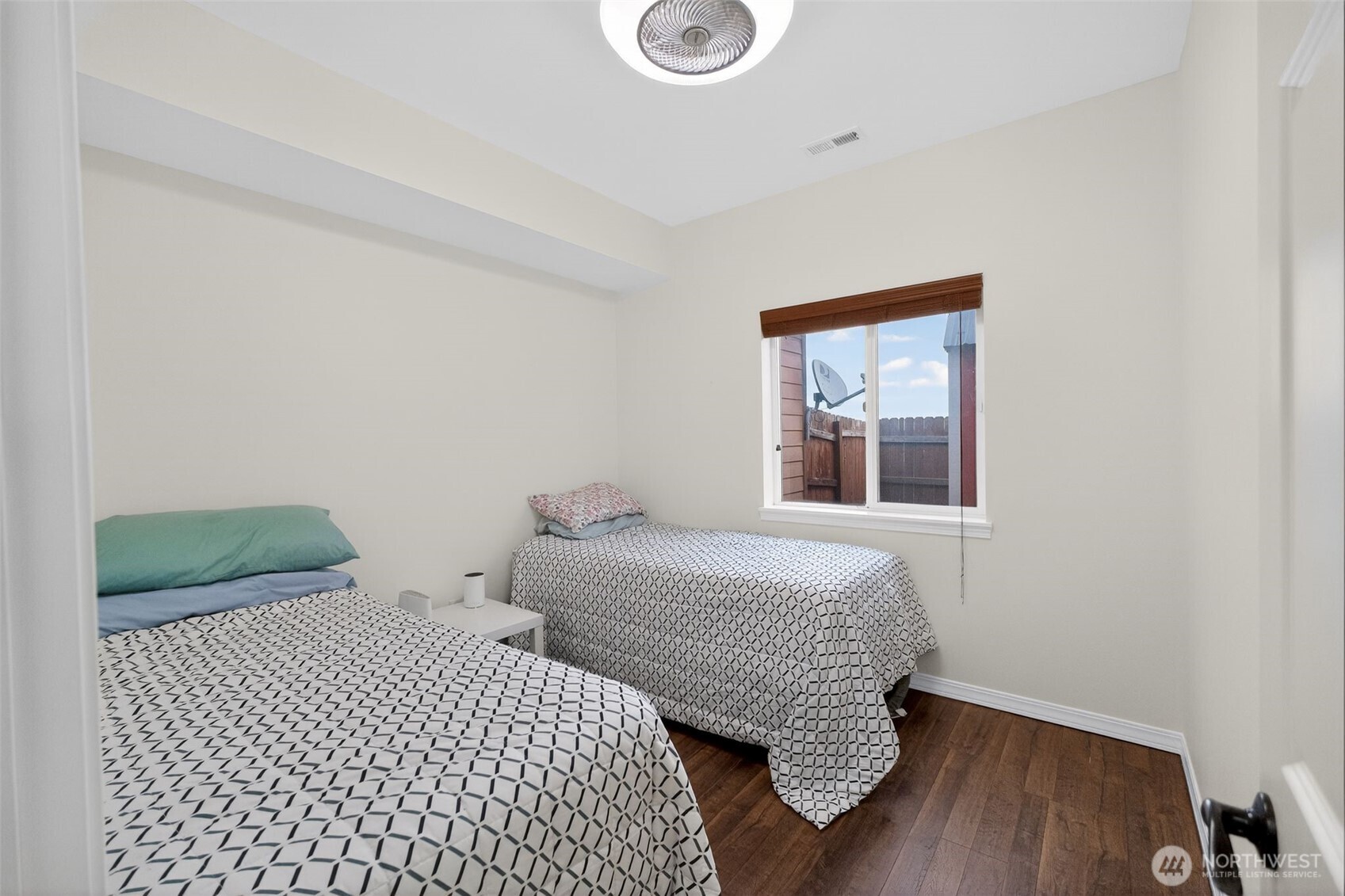 1427 West Century Street Moses Lake, WA 98837 - Photo 25 of 30 a bedroom with a bed and wooden floor