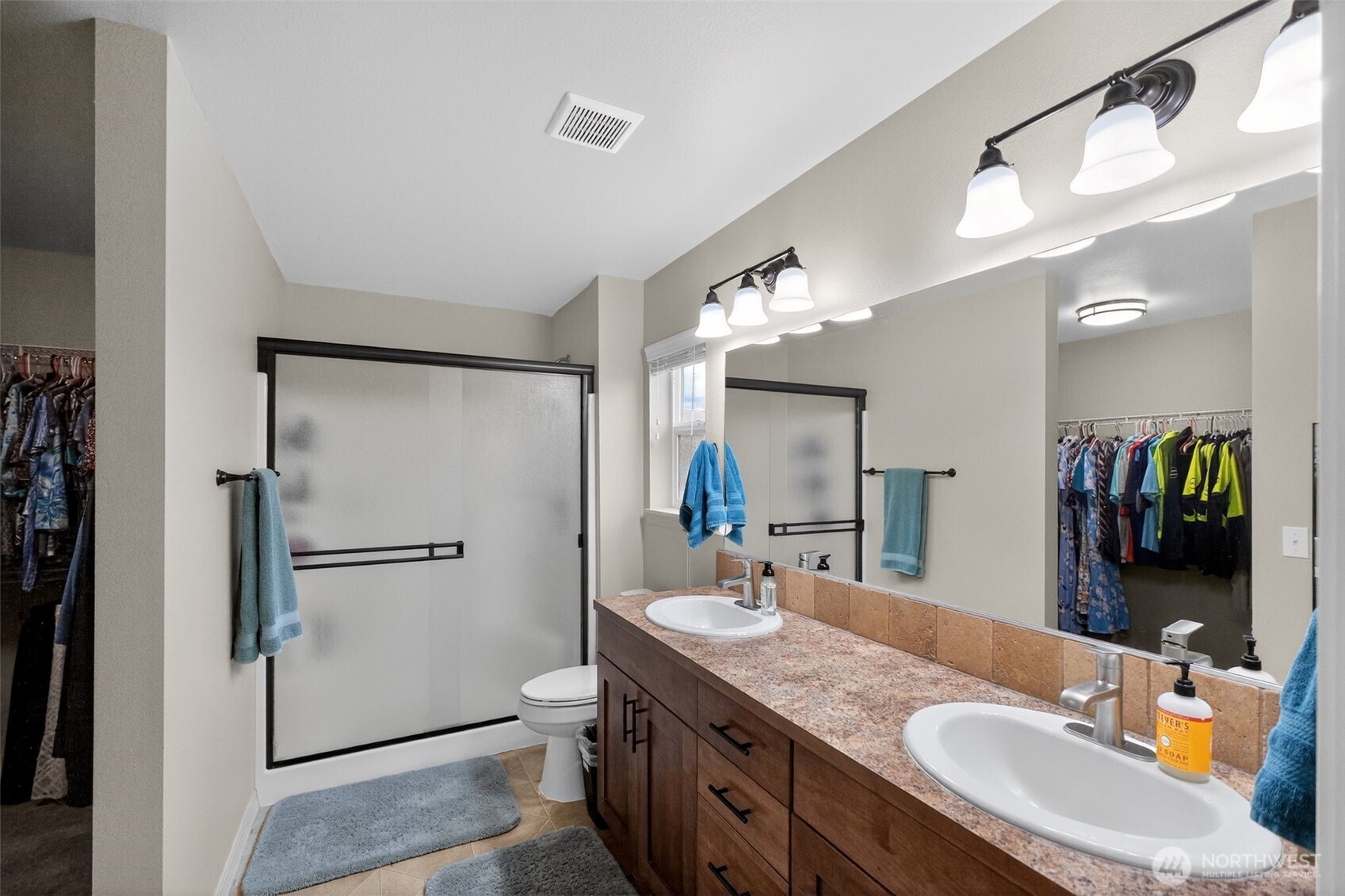 1427 West Century Street Moses Lake, WA 98837 - Photo 27 of 30 a bathroom with a granite countertop shower sink vanity and mirror