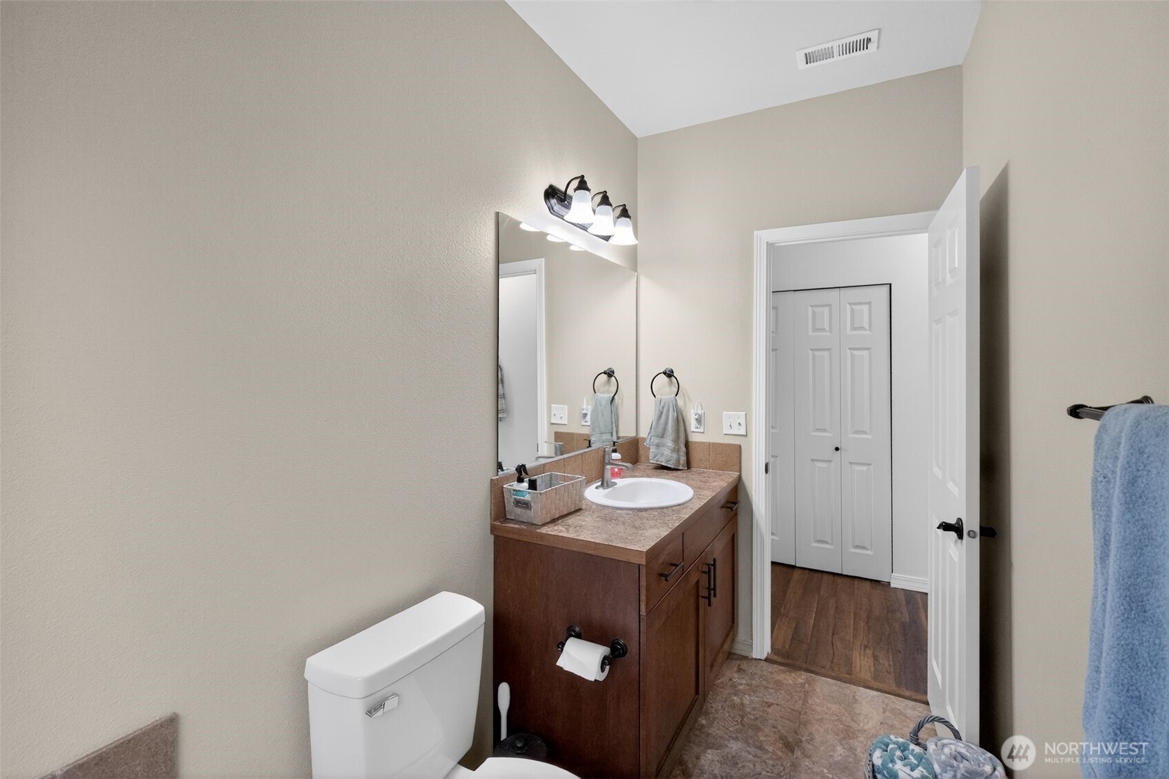 1427 West Century Street Moses Lake, WA 98837 - Photo 30 of 30 a bathroom with a sink a toilet and a mirror