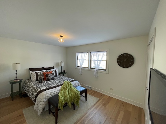446 East 90th Street Chicago, IL 60619 - Photo 15 of 36 a bedroom with a bed and window