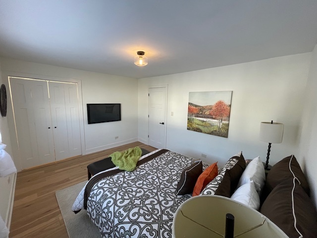 446 East 90th Street Chicago, IL 60619 - Photo 17 of 36 a bed room with a bed and a couch
