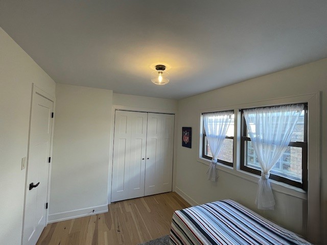 446 East 90th Street Chicago, IL 60619 - Photo 21 of 36 a view of empty room with window and wooden floor