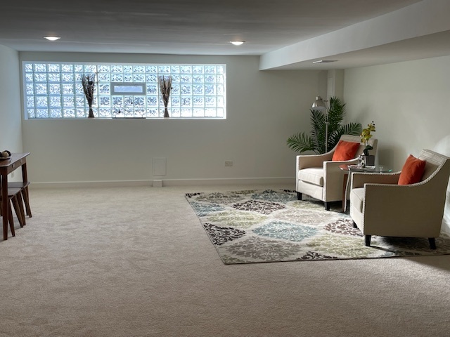 446 East 90th Street Chicago, IL 60619 - Photo 26 of 36 a room with a couch and a window