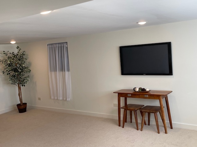 446 East 90th Street Chicago, IL 60619 - Photo 28 of 36 a living room with furniture and a flat screen tv