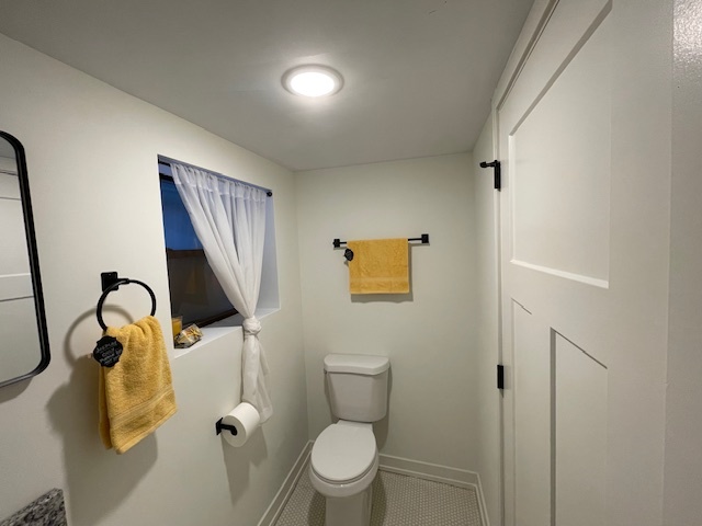 446 East 90th Street Chicago, IL 60619 - Photo 31 of 36 a bathroom with a toilet sink and mirror