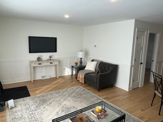 446 East 90th Street Chicago, IL 60619 - Photo 7 of 36 a living room with furniture and a flat screen tv