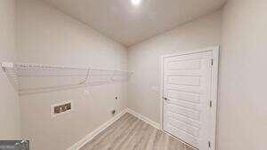 233 Carsons Walk Macon, GA 31206 - Photo 3 of 15 a view of walk in closet with empty racks