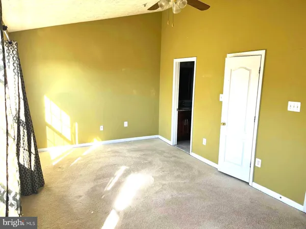 a view of a big room with windows