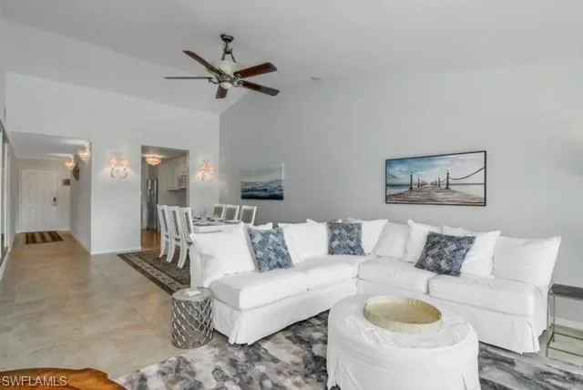 a living room with furniture and a rug