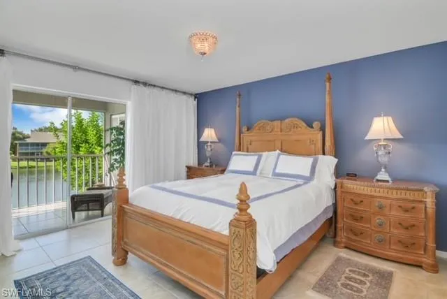 a bed room with a bed and a lamp