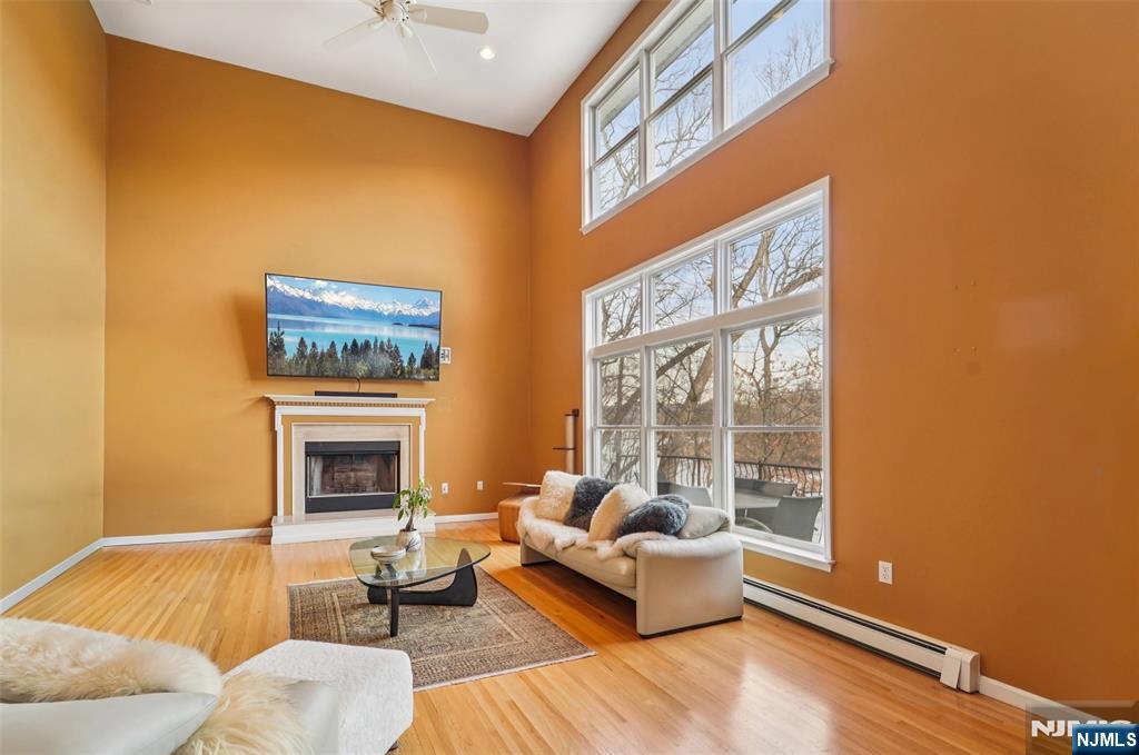 185 Summit Avenue Pompton Lakes, NJ 07442 - Photo 12 of 36 a living room with furniture and a fireplace