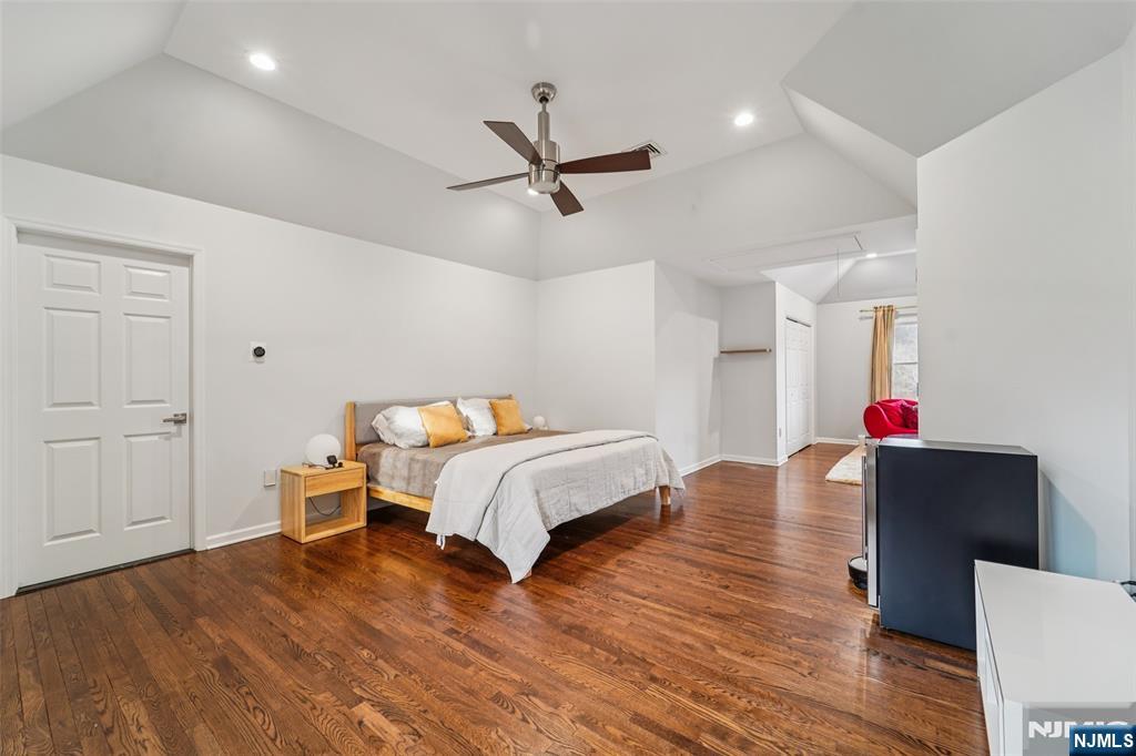 185 Summit Avenue Pompton Lakes, NJ 07442 - Photo 16 of 36 a bed room with a bed and wooden floor