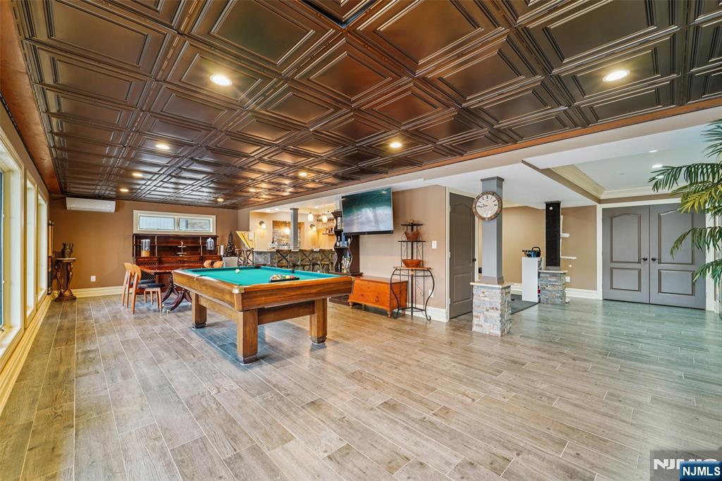 185 Summit Avenue Pompton Lakes, NJ 07442 - Photo 24 of 36 a room with wooden floors and pool table
