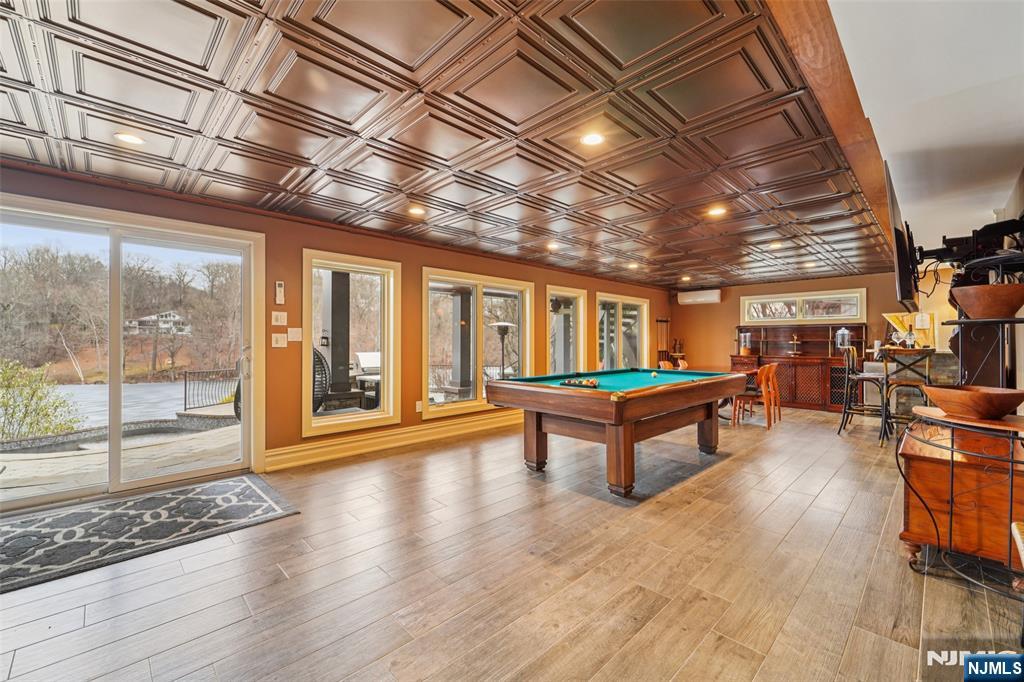 185 Summit Avenue Pompton Lakes, NJ 07442 - Photo 25 of 36 a room with lots of wooden furniture and a floor to ceiling window