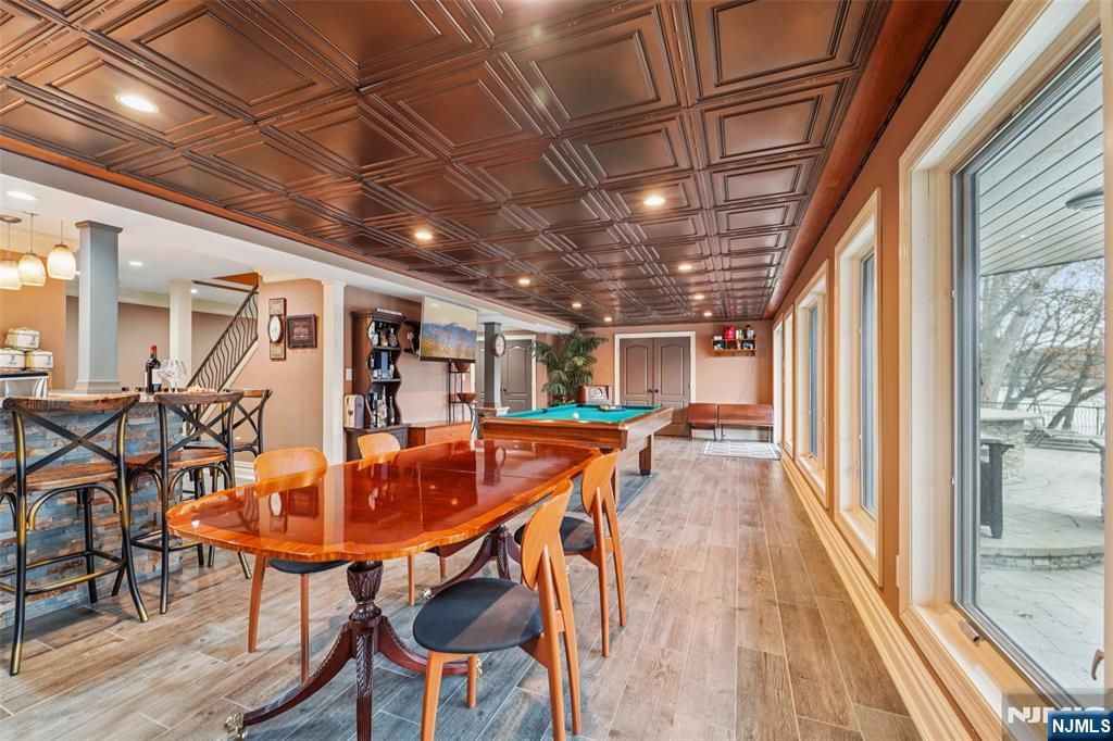185 Summit Avenue Pompton Lakes, NJ 07442 - Photo 27 of 36 a dining room with furniture a chandelier and wooden floor