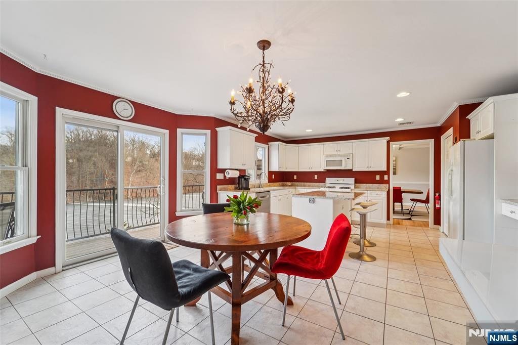 185 Summit Avenue Pompton Lakes, NJ 07442 - Photo 7 of 36 a dining room with furniture and a chandelier