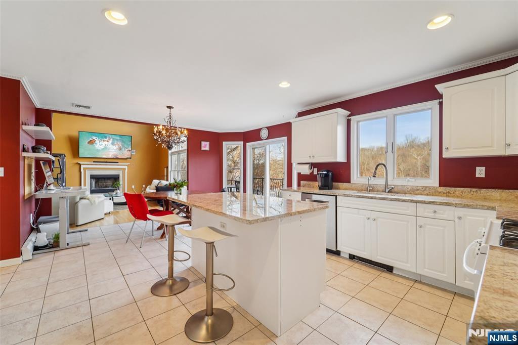 185 Summit Avenue Pompton Lakes, NJ 07442 - Photo 10 of 36 a kitchen with stainless steel appliances kitchen island granite countertop a sink and cabinets