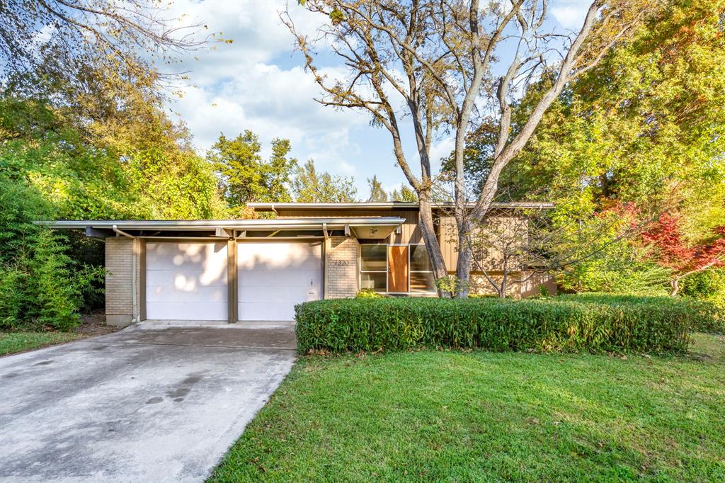 7320 Walling Lane Dallas, TX 75231 - Photo 1 of 40 front view of a house with a yard